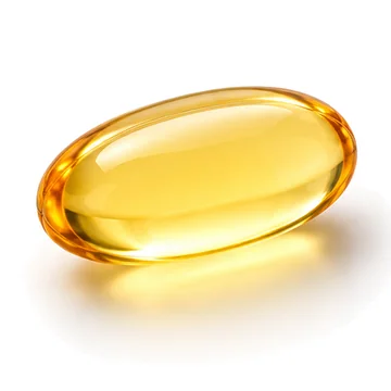 Close-up of a golden softgel